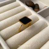 Black and white square ring