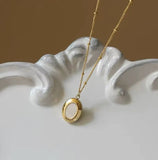 White oval neckl
